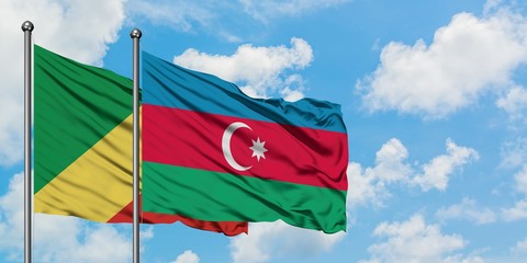 Republic Of The Congo and Azerbaijan flag waving in the wind against white cloudy blue sky...