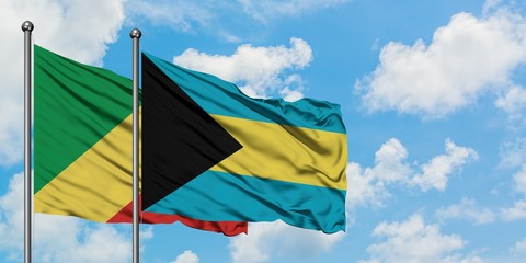 Republic Of The Congo and Bahamas flag waving in the wind against white cloudy blue sky together. Diplomacy concept, international relations.
