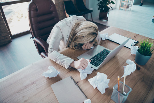 High angle above view photo of business lady head lying on desk listen online report crumple papers awful corporate situation sit chair formalwear blazer workplace office - Powered by Adobe