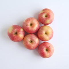 Red ripe apples close-up on a white background. Top view.