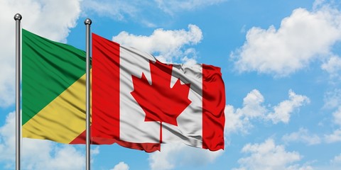 Republic Of The Congo and Canada flag waving in the wind against white cloudy blue sky together. Diplomacy concept, international relations.