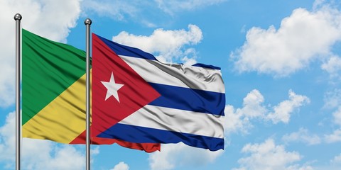 Republic Of The Congo and Cuba flag waving in the wind against white cloudy blue sky together. Diplomacy concept, international relations.