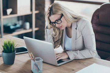 Photo of beautiful business lady looking notebook table watching online report overworked analyzing...