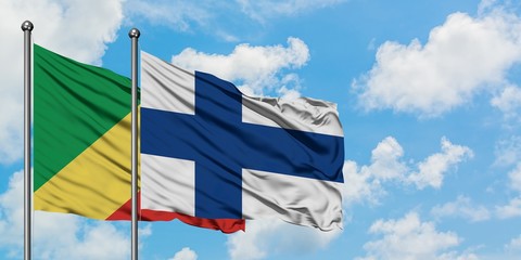 Republic Of The Congo and Finland flag waving in the wind against white cloudy blue sky together. Diplomacy concept, international relations.