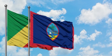 Republic Of The Congo and Guam flag waving in the wind against white cloudy blue sky together. Diplomacy concept, international relations.