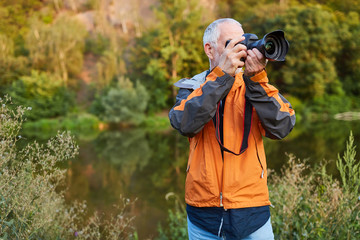 Landscape photographer in nature while photographing