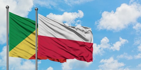 Republic Of The Congo and Poland flag waving in the wind against white cloudy blue sky together. Diplomacy concept, international relations.