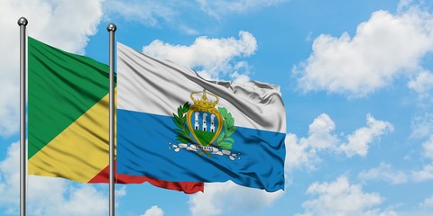 Republic Of The Congo and San Marino flag waving in the wind against white cloudy blue sky together. Diplomacy concept, international relations.