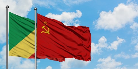 Republic Of The Congo and Soviet Union flag waving in the wind against white cloudy blue sky together. Diplomacy concept, international relations.