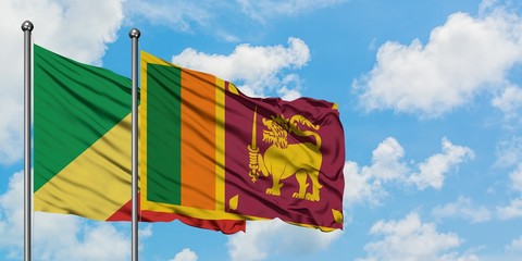 Republic Of The Congo and Sri Lanka flag waving in the wind against white cloudy blue sky together....