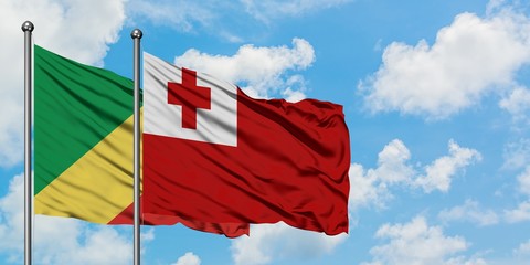Republic Of The Congo and Tonga flag waving in the wind against white cloudy blue sky together. Diplomacy concept, international relations.