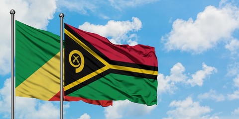 Republic Of The Congo and Vanuatu flag waving in the wind against white cloudy blue sky together....