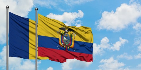 Romania and Ecuador flag waving in the wind against white cloudy blue sky together. Diplomacy...