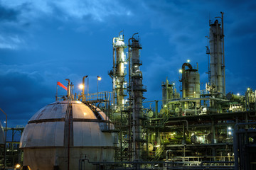 Gas storage spheres tank in petrochemical plant at night