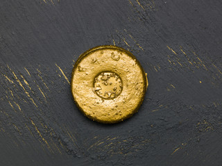 many different golden christmas cookies on black, golden background