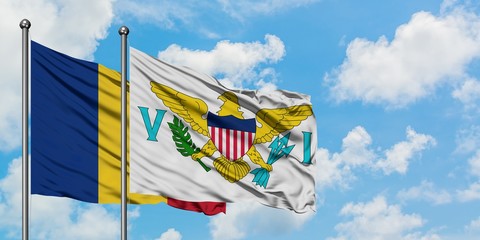 Romania and United States Virgin Islands flag waving in the wind against white cloudy blue sky together. Diplomacy concept, international relations.