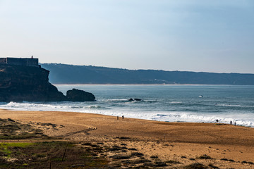 Nazaré Lighthouse at Atlantic ocean coast, Portugal.