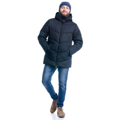 Man in winter jacket and warm hat walking goes