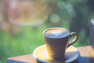 cup of coffee on wooden table