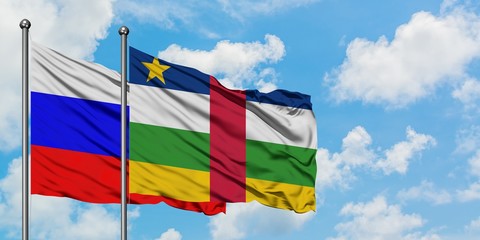 Russia and Central African Republic flag waving in the wind against white cloudy blue sky together. Diplomacy concept, international relations.