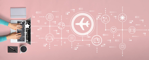 Airplane travel theme with person using a laptop © Tierney