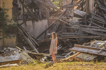 A woman looks at a blockage from the building.