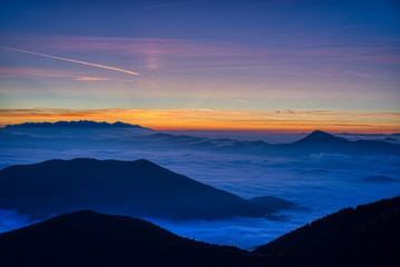 Mist flood the valley and mountains at the beautiful sunrise, slovakia, great rozutec