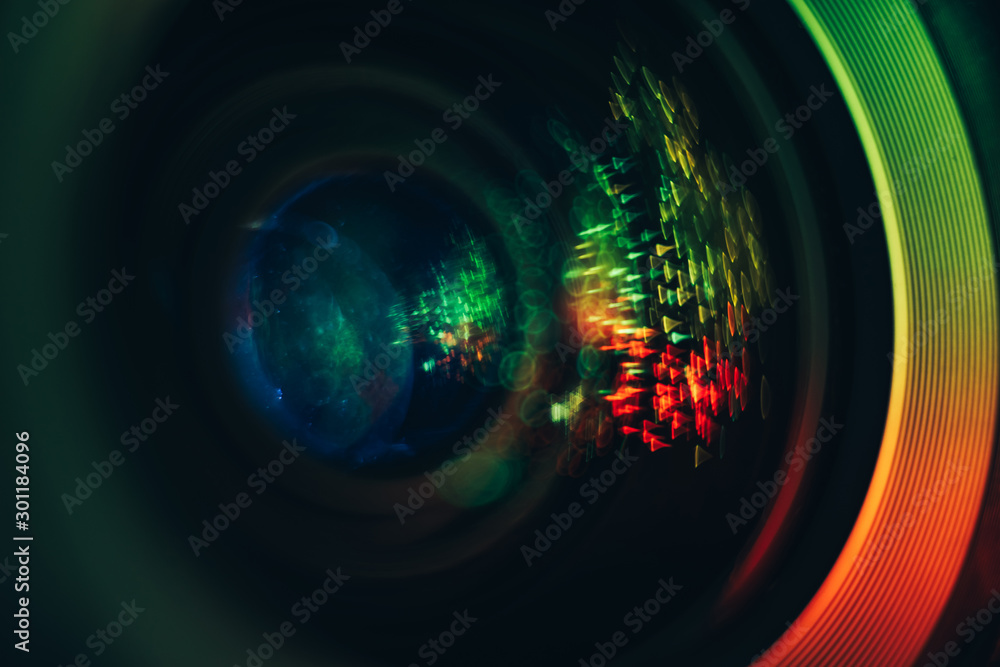 Poster beautiful abstract camera lens background multi colored glass reflection. macro photography view.