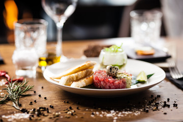 Tuna tartare served on a plate in restaurant