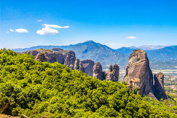 Scenic Meteora Valley view with the Holy Monastery of Rousanou, part of the Eastern Orthodox monastery complex of Meteora, Central Greece