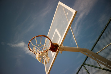 	Basketball shooting outside court closer shot to the rim