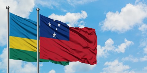 Rwanda and Samoa flag waving in the wind against white cloudy blue sky together. Diplomacy concept, international relations.