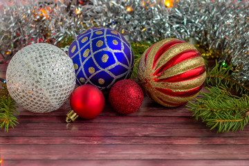 New Year's multi-colored glass balls lie on a hard surface