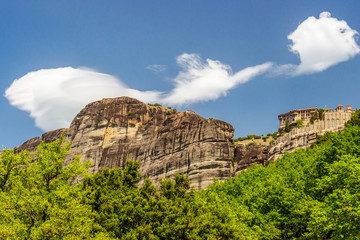 Scenic view of Meteora Valley with rock formations and the Holy Monastery of Varlaam, part of the Eastern Orthodox monastery complex of Meteora, Central Greece