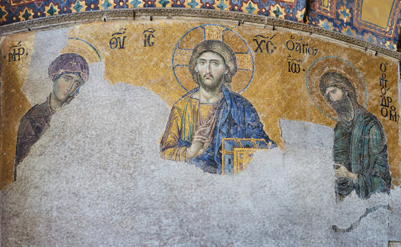 13th century Deesis Mosaic of Jesus Christ flanked by the Virgin Mary and John the Baptist in the Hagia Sophia temple in Istanbul, Turkey.