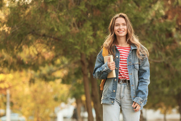 Portrait of teenage female student outdoors