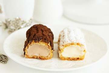 Sectional homemade eclairs, chocolate and vanilla.