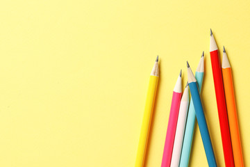 Color pencils on a yellow background. Place for text