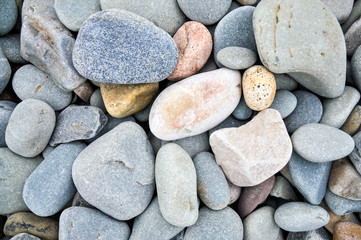 Fototapeta na wymiar A beautiful collection of zen beach pebbles on the shore of the Atlantic Ocean outside Dartmouth, Nova Scotia.
