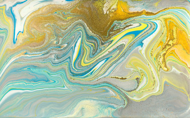 Colorful pastel marble pattern with golden glitter. Abstract liquid background