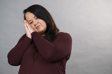 Woman being sleepy gesturing