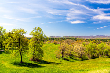 Beautiful rolling hills and the distant Blue Ridge Mountains can be seen in early spring near Asheville, NC, a premier tourist destination in the Southern United States.