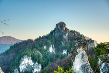 rock in autumn with fallen leaves on the ground, slovakia, sulovske rocks
