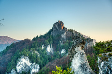 rock in autumn with fallen leaves on the ground, slovakia, sulovske rocks