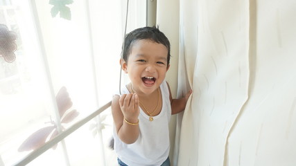 A happy Asian little boy cute big smile at home. and have very nice smile can use for dental background.