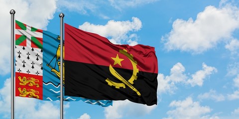 Saint Pierre And Miquelon and Angola flag waving in the wind against white cloudy blue sky...