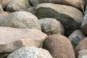 A pile of large gray stones. Many gray stones. The collapse of the stones.