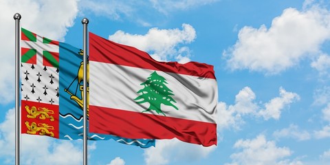Saint Pierre And Miquelon and Lebanon flag waving in the wind against white cloudy blue sky together. Diplomacy concept, international relations.