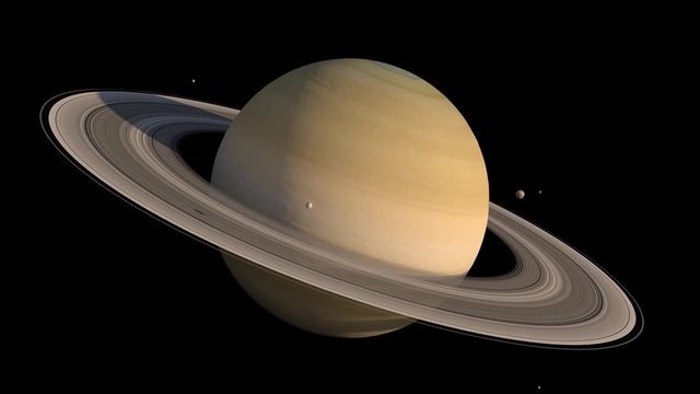 Planet Saturn detailed close-up with the rings and the moons rotating in slow motion for space exploration backgrounds