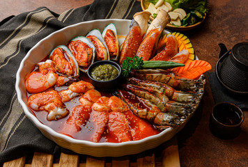 Korean Food Style : Top view Seafood set , squid , New Zealand mussels , salmon and prawn with...